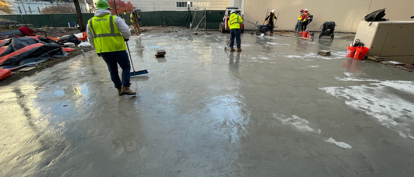 ShanCon employees spreading concrete waterproofing