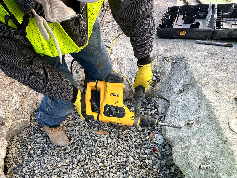 ShanCon concrete repair and restoration service with subcontractor jackhammering a concrete pad